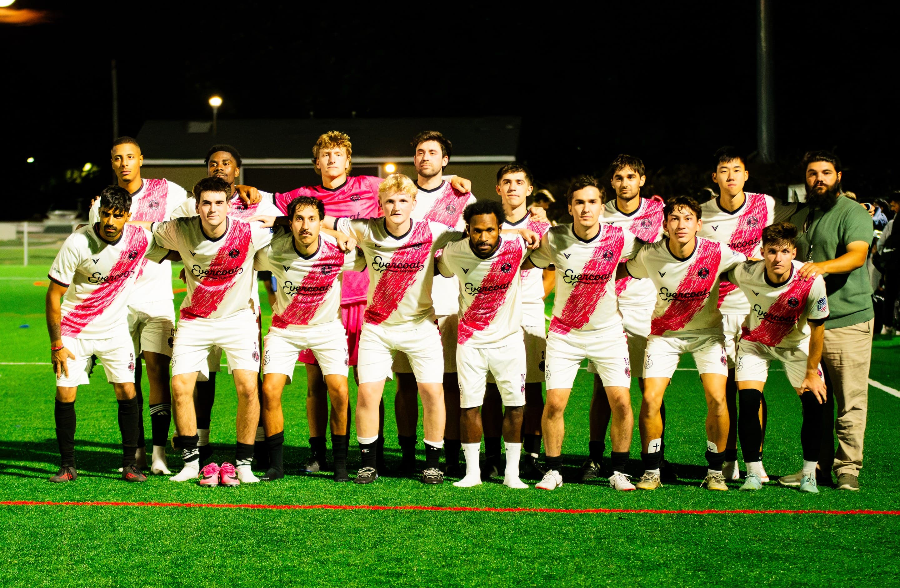 Wheaton Wanderers FC squad lined up on the pitch at night
